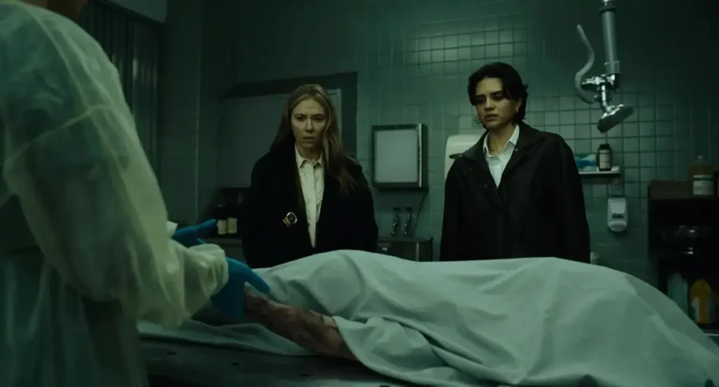 Mike Flanagan Clears Up ‘The Exorcist: Martyrs’ Timeline and Hints at Legacy Connections Scarlett Johansson as New York City homicide detective Julie Miller and Sasha Calle as detective Gina Restrepo in a scene from the upcoming supernatural horror film The Exorcist: Martyrs (2027), directed by Mike Flanagan.
